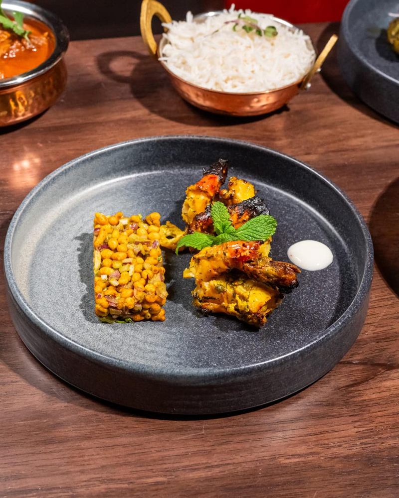 A plated starter on dark stoneware